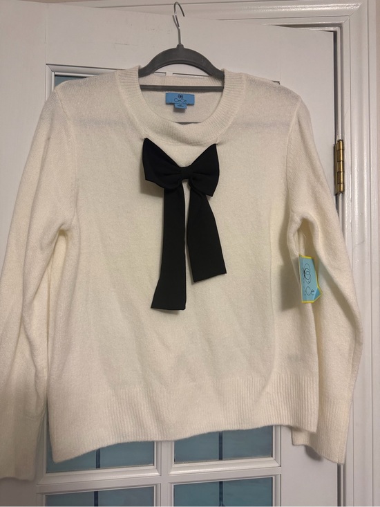 CeCe Sweaters - CeCe Cream Crewneck Sweater with Black Bow Accent